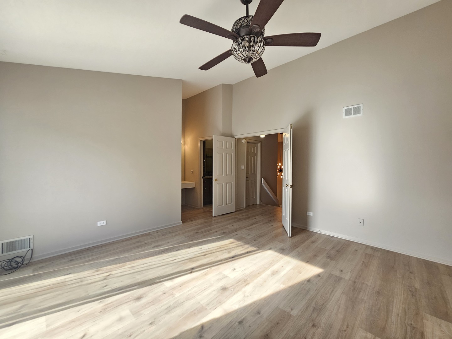 475 Bridle Trail Wheeling, IL 60090 - Photo 17 of 27 a view of a livingroom with a ceiling fan and window
