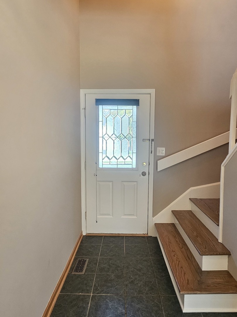 475 Bridle Trail Wheeling, IL 60090 - Photo 2 of 27 a view of entryway with window