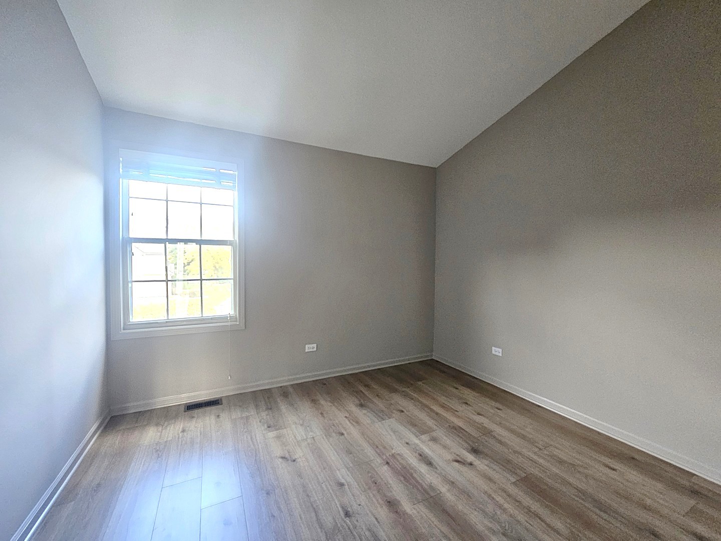 475 Bridle Trail Wheeling, IL 60090 - Photo 24 of 27 wooden floor in an empty room with a window