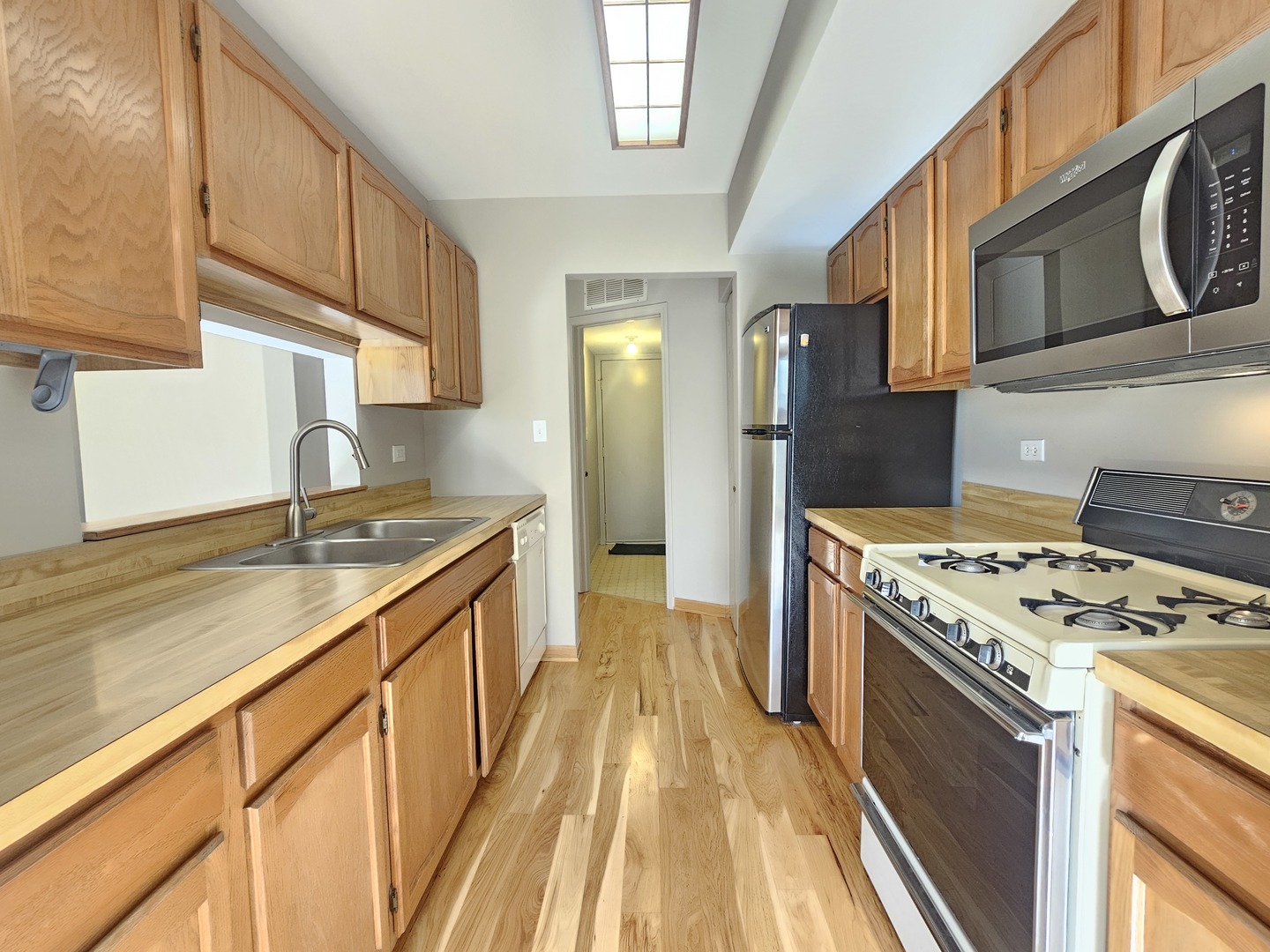 475 Bridle Trail Wheeling, IL 60090 - Photo 9 of 27 a kitchen with stainless steel appliances granite countertop a stove and a sink