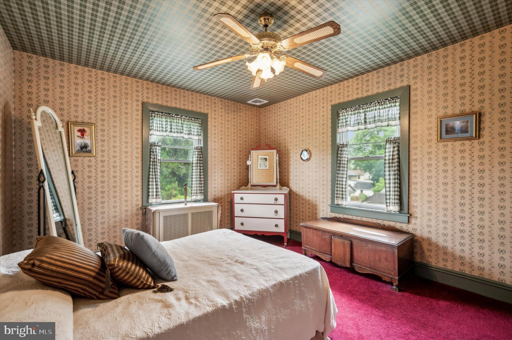 253 Sagamore Road Havertown, PA 19083 - Photo 21 of 25 a bedroom with a bed and a chandelier