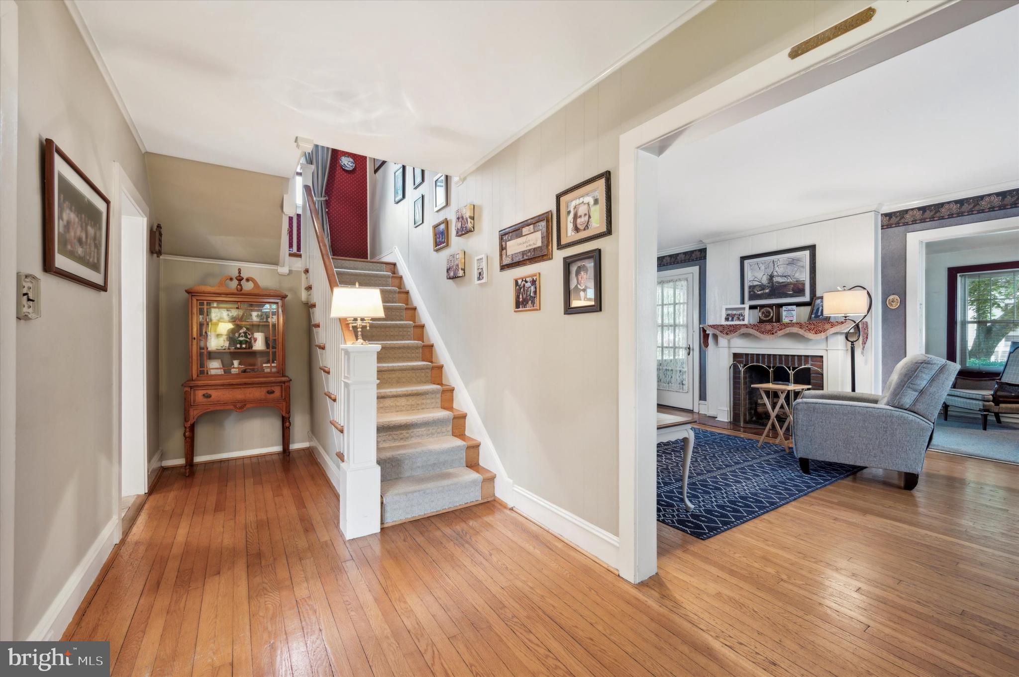 253 Sagamore Road Havertown, PA 19083 - Photo 5 of 25 a view of a livingroom with hardwood floor and a ceiling fan