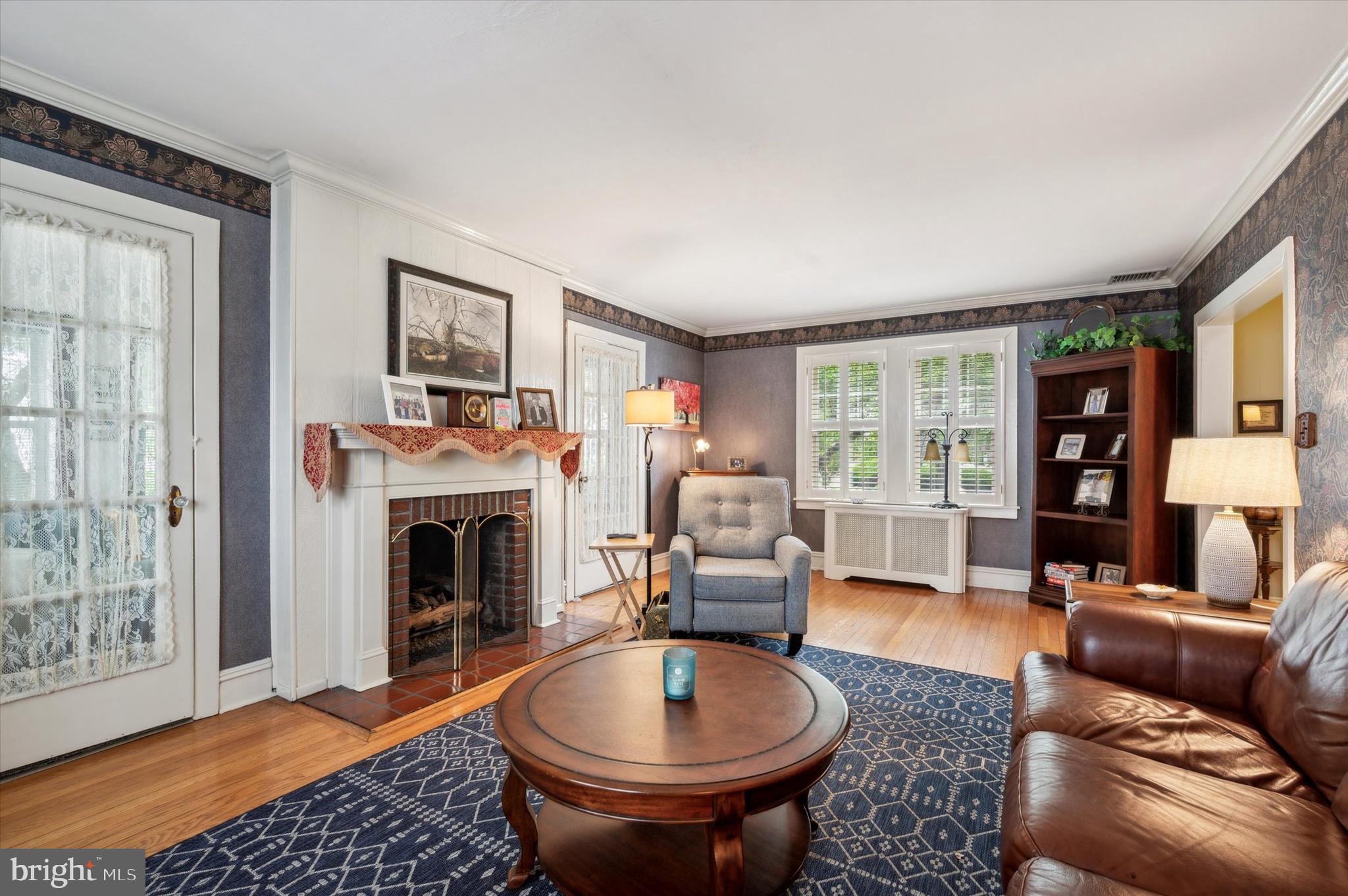 253 Sagamore Road Havertown, PA 19083 - Photo 7 of 25 a living room with furniture and a fireplace