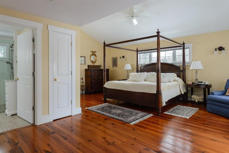 4310 Main Street Barnstable, MA 02675 - Photo 12 of 18 a bedroom with a bed and wooden floor