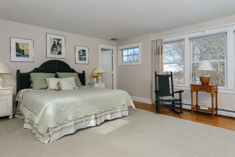 4310 Main Street Barnstable, MA 02675 - Photo 13 of 18 a bedroom with a bed and view of living room