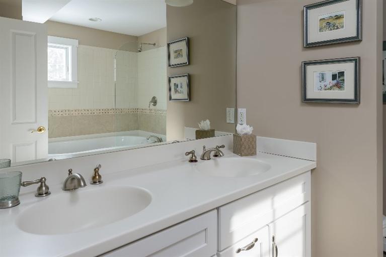 4310 Main Street Barnstable, MA 02675 - Photo 14 of 18 a bathroom with a sink and a mirror