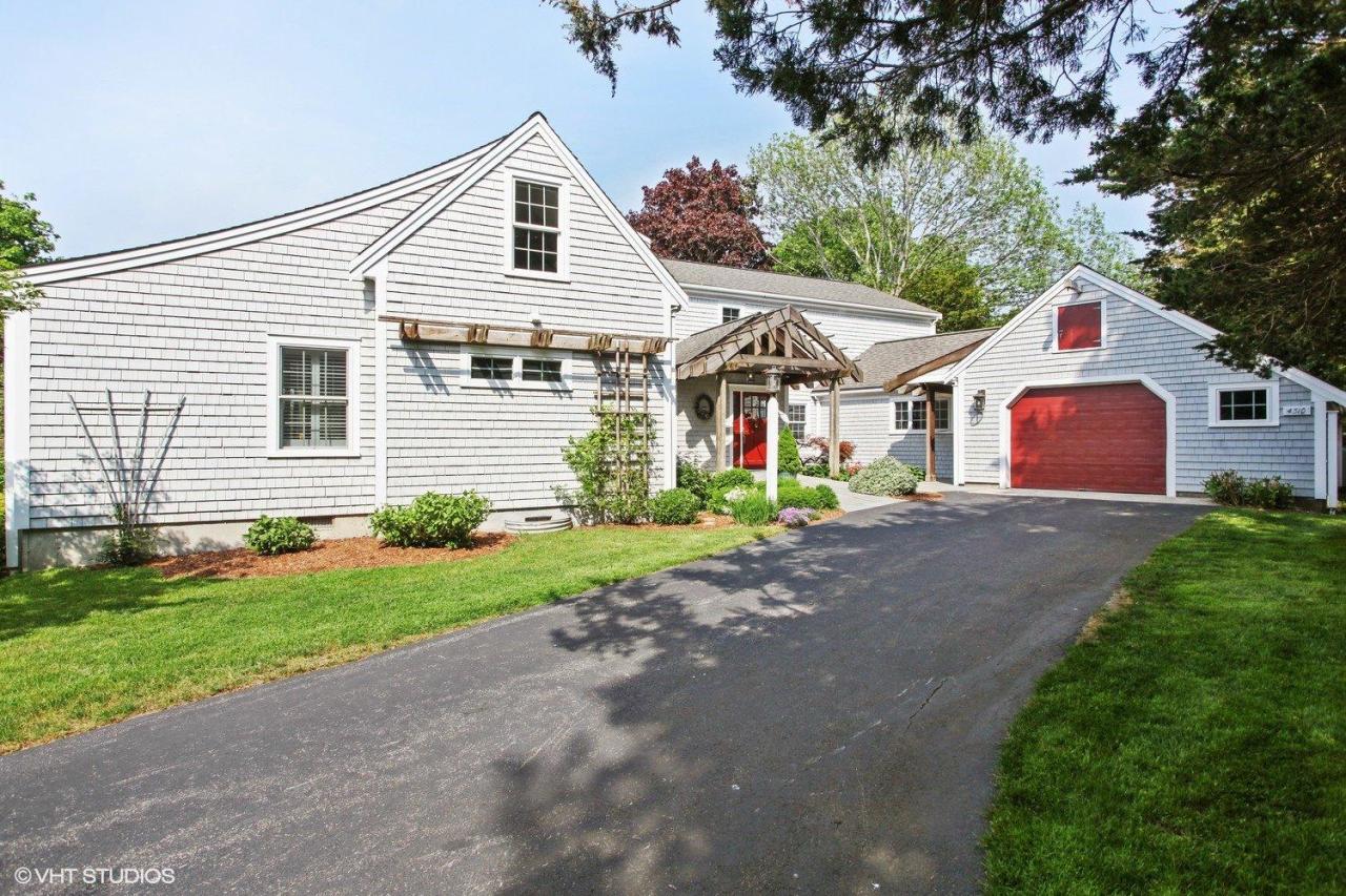 4310 Main Street Barnstable, MA 02675 - Photo 2 of 18 a front view of a house with a garden