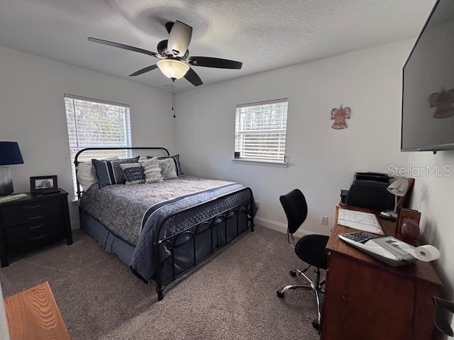 1270 Southwest 14th Street Chiefland, FL 32626 - Photo 13 of 41 a bedroom with a bed and a desk