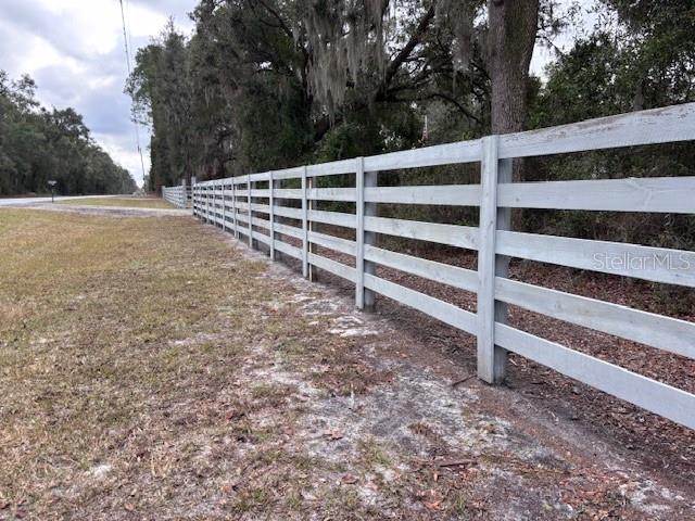1270 Southwest 14th Street Chiefland, FL 32626 - Photo 37 of 41 a view of a yard with wooden fence