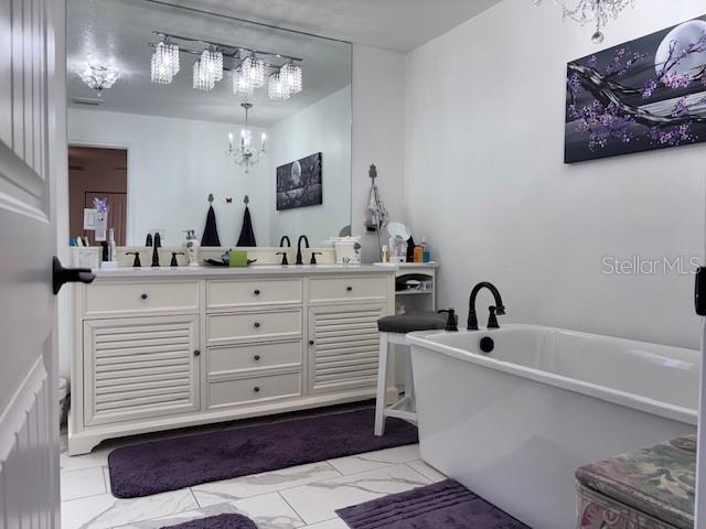 1270 Southwest 14th Street Chiefland, FL 32626 - Photo 8 of 41 a bathroom with a sink vanity and mirror