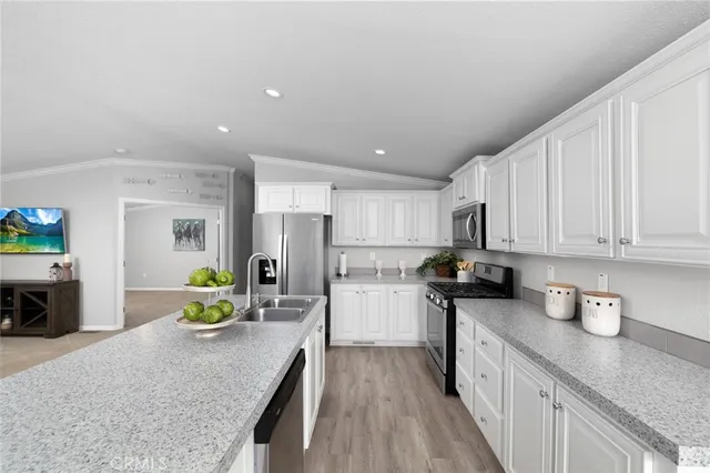 a kitchen with refrigerator and stove