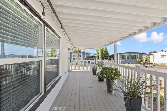 a view of a chairs and table in the balcony