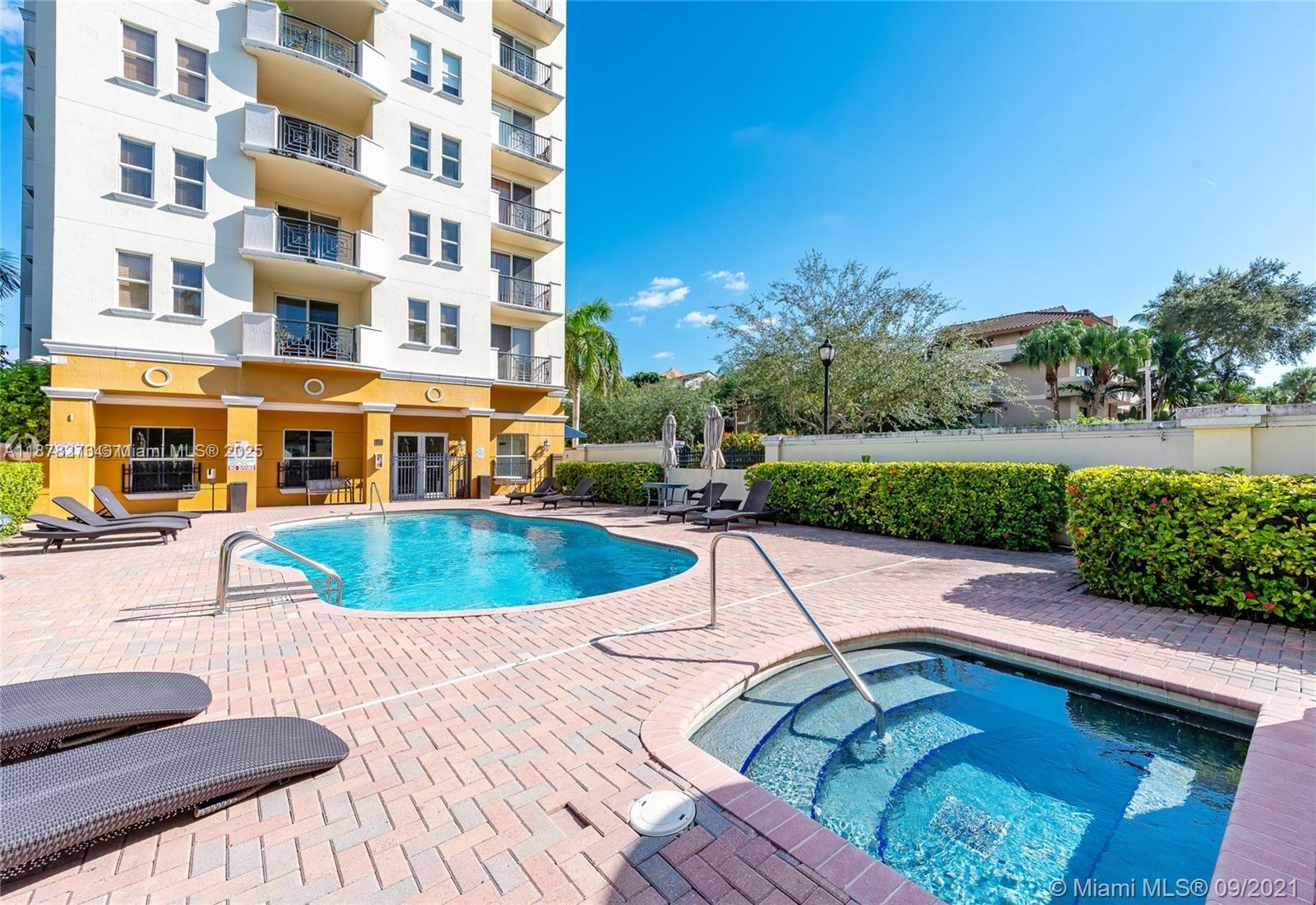 9021 Southwest 94th Street, Unit PH07 Miami, FL 33176 - Photo 28 of 32 a view of a swimming pool with a patio