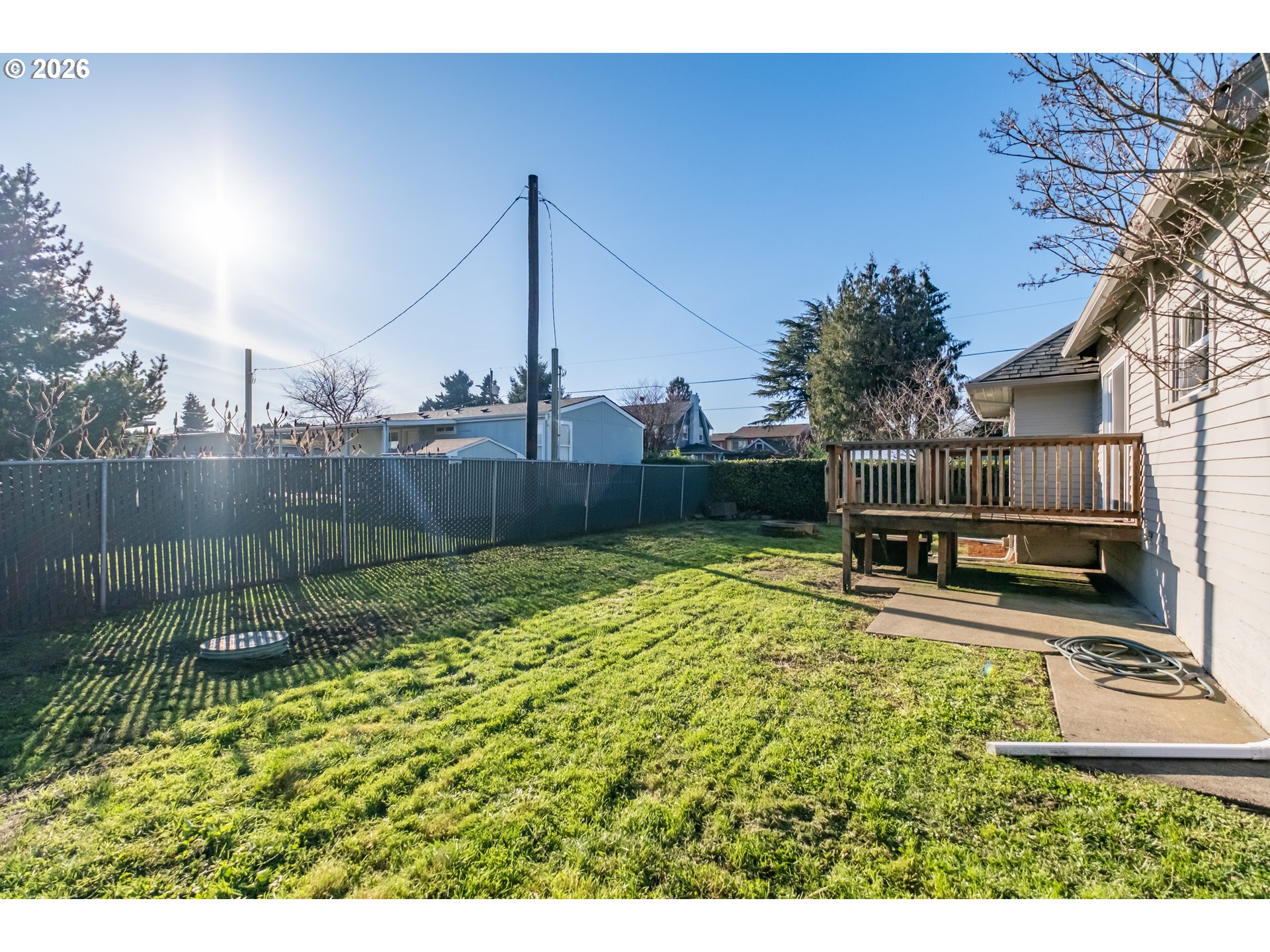 3392 Sunnyview Road Northeast Salem, OR 97301 - Photo 29 of 47 a view of a backyard with a table and chairs