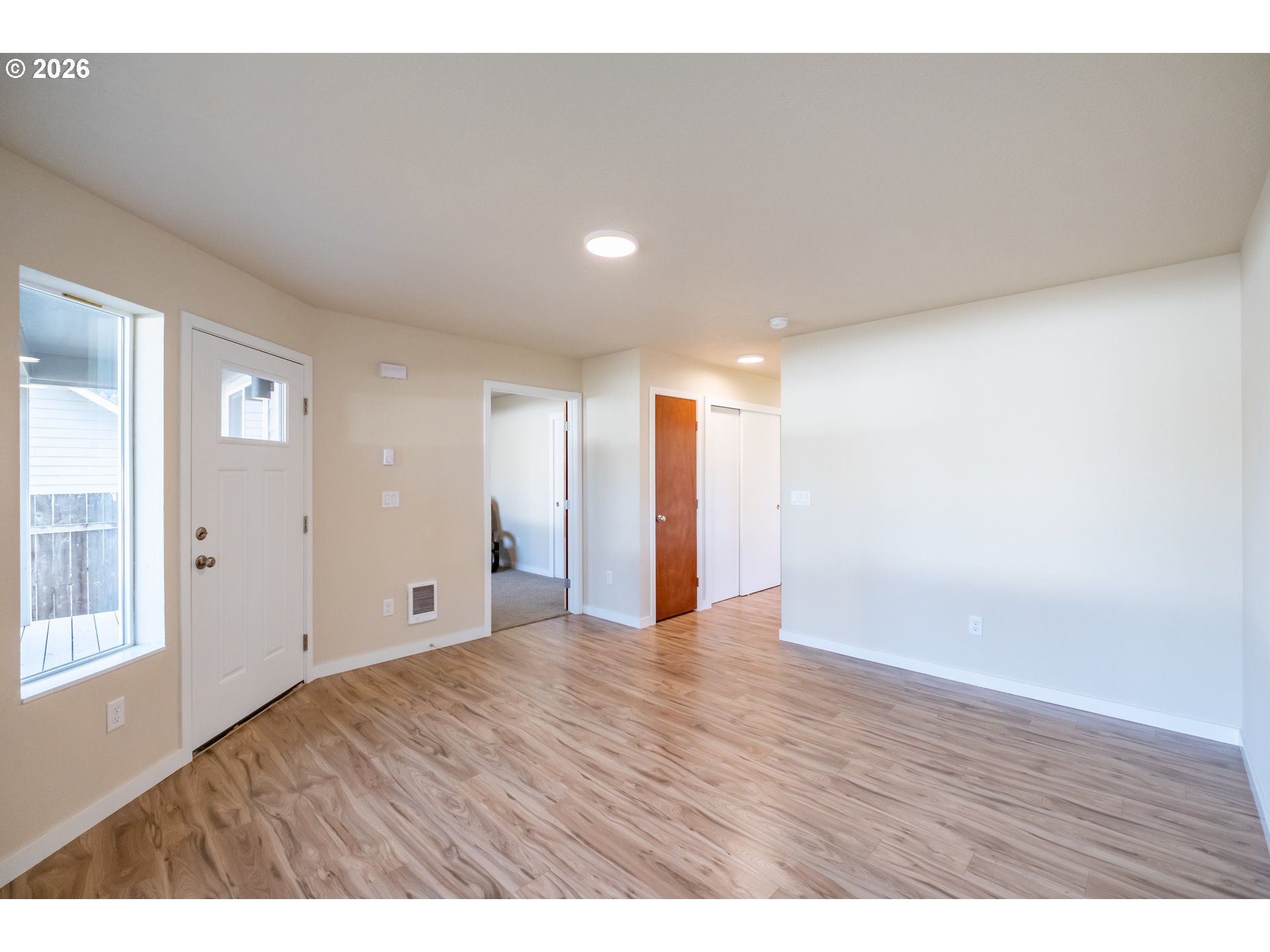 3392 Sunnyview Road Northeast Salem, OR 97301 - Photo 32 of 47 a view of an empty room with wooden floor