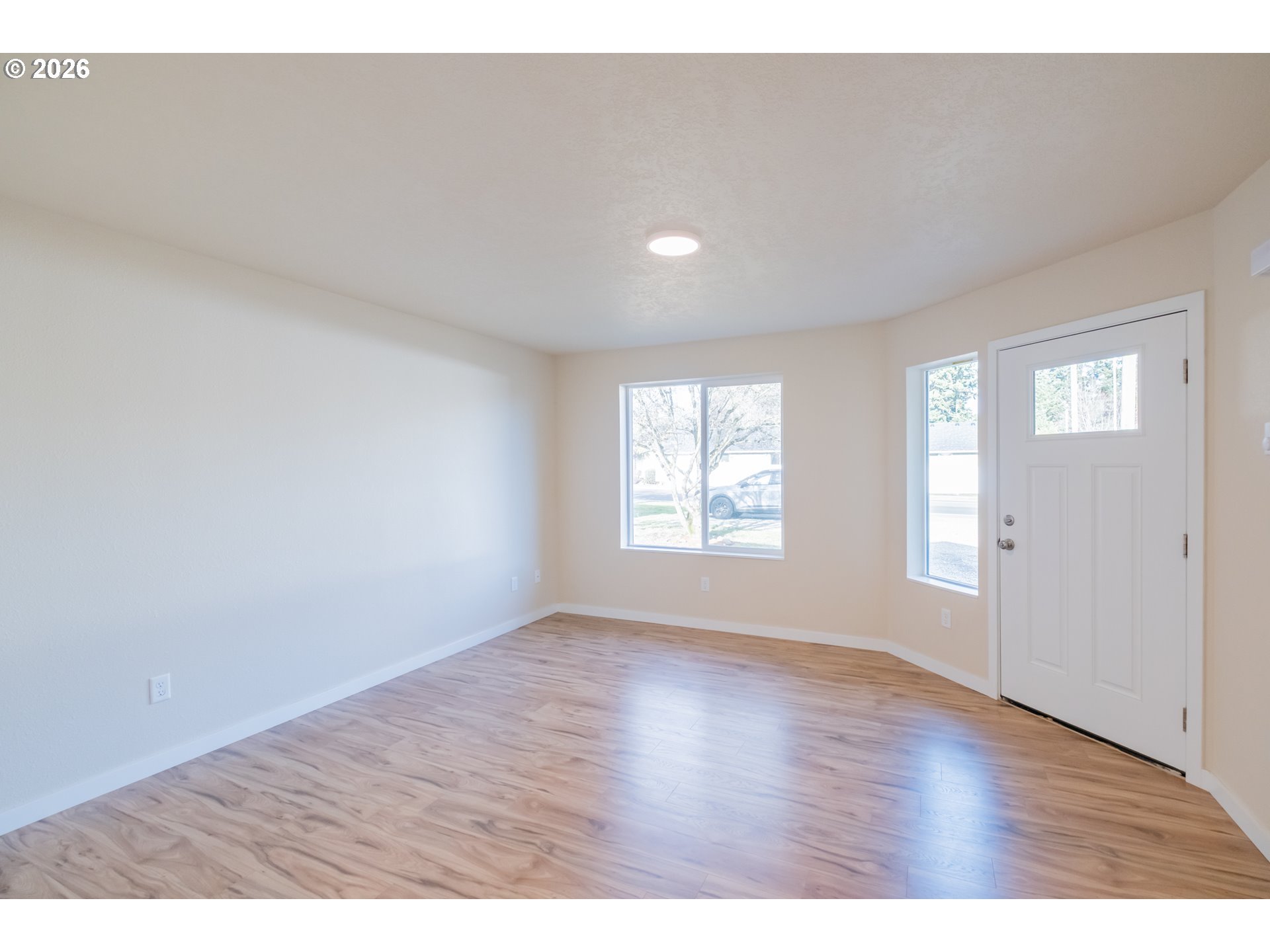 3392 Sunnyview Road Northeast Salem, OR 97301 - Photo 35 of 47 a view of an empty room with wooden floor and a window