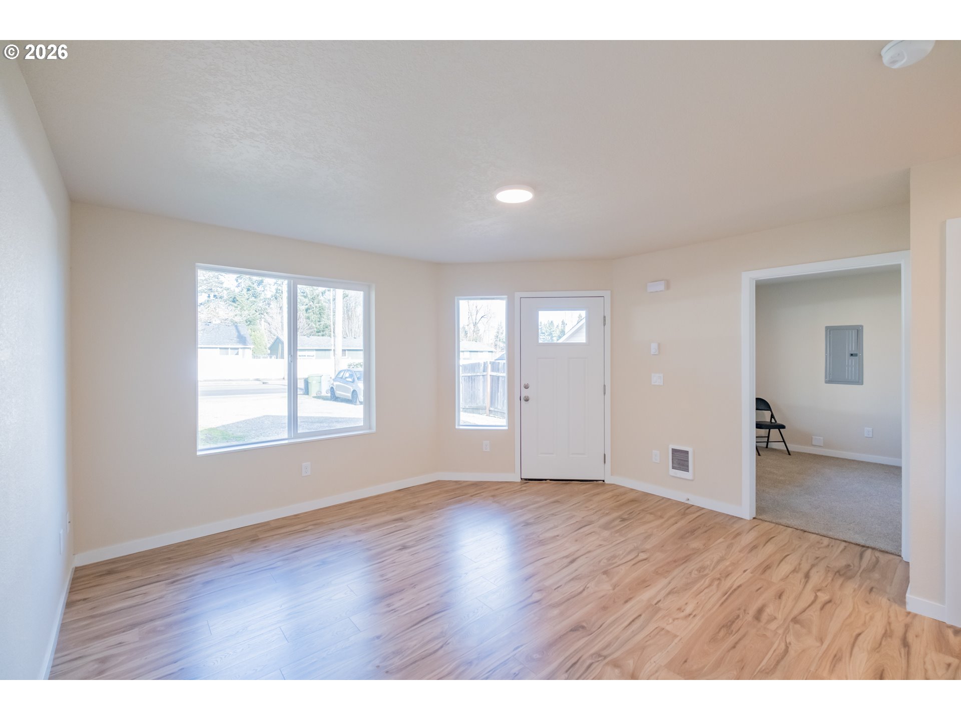3392 Sunnyview Road Northeast Salem, OR 97301 - Photo 46 of 47 a view of an empty room with wooden floor and a window