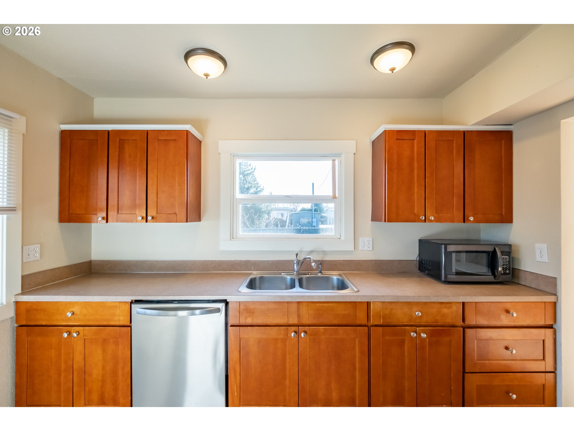 3392 Sunnyview Road Northeast Salem, OR 97301 - Photo 8 of 47 a kitchen with stainless steel appliances granite countertop a sink and cabinets