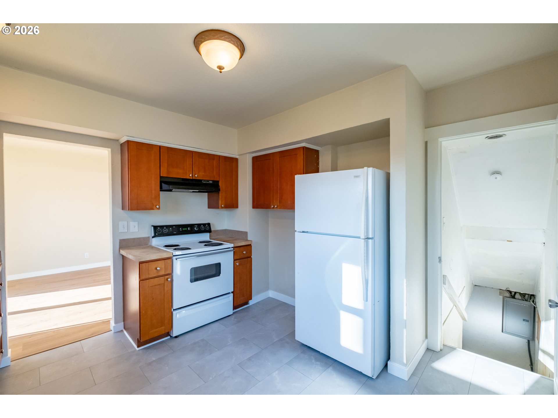 3392 Sunnyview Road Northeast Salem, OR 97301 - Photo 9 of 47 a kitchen with stainless steel appliances a refrigerator a stove a microwave a sink and a window