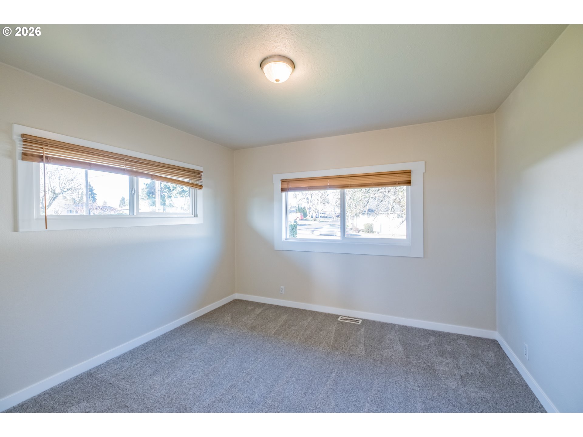 3392 Sunnyview Road Northeast Salem, OR 97301 - Photo 10 of 47 an empty room with windows