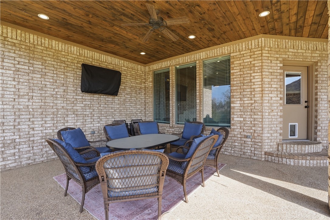 3516 Foxcroft Path Bryan, TX 77808 - Photo 28 of 38 a outdoor living space with furniture and a flat screen tv