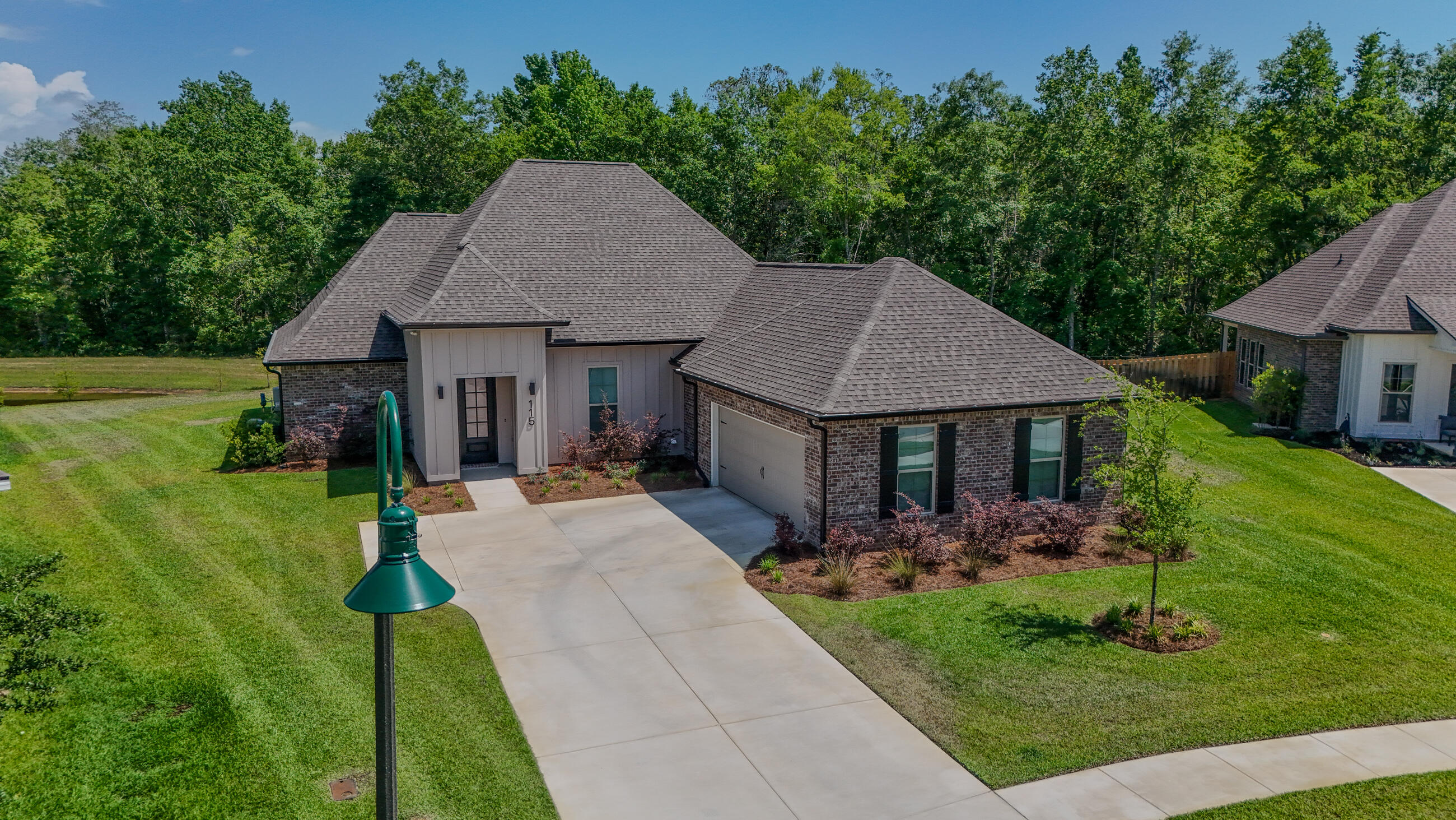 115 Flora Lane Freeport, FL 32439 - Photo 1 of 69 a front view of house with yard and green space