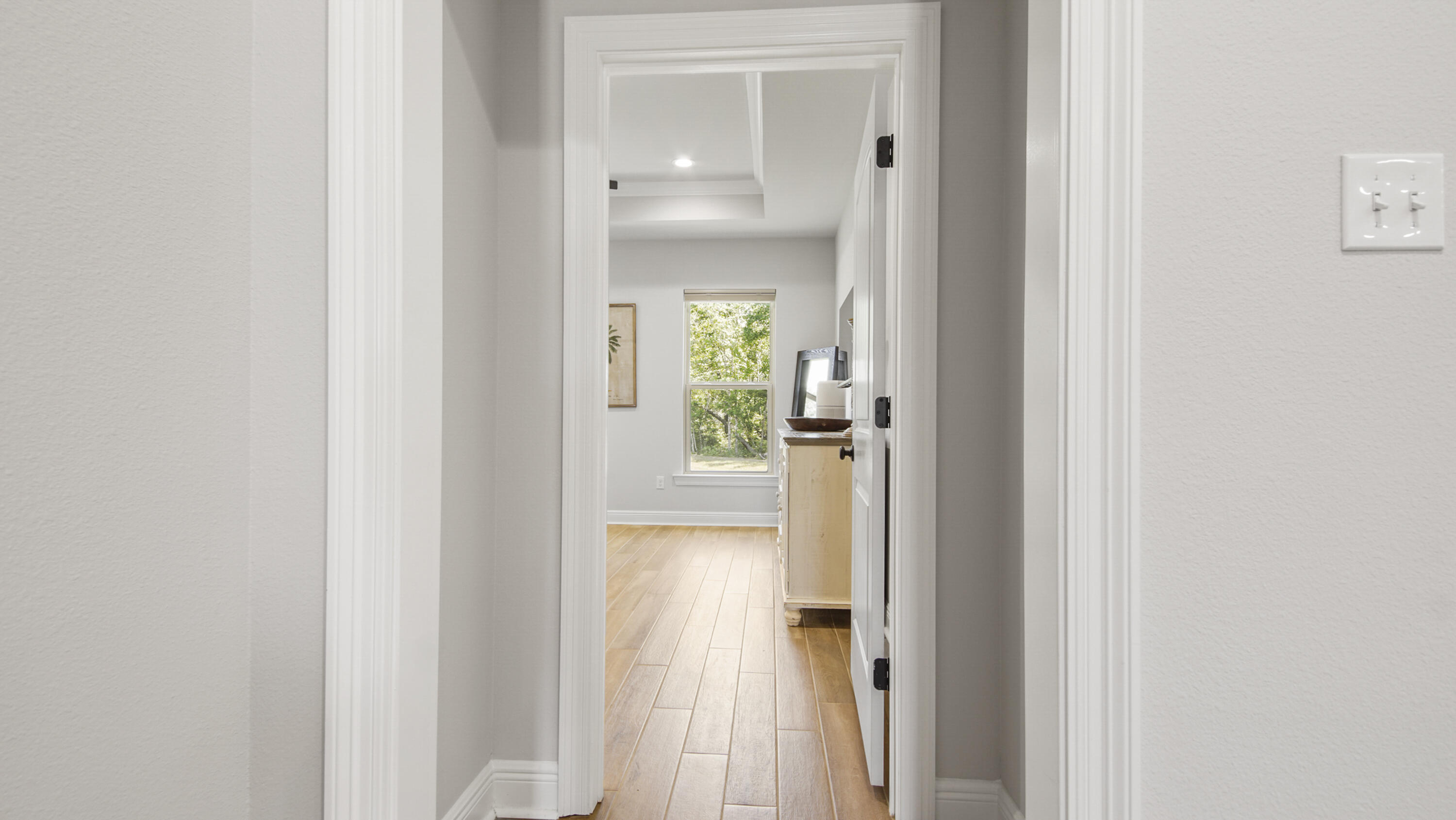 115 Flora Lane Freeport, FL 32439 - Photo 11 of 69 a view of a hallway with wooden floor and a door