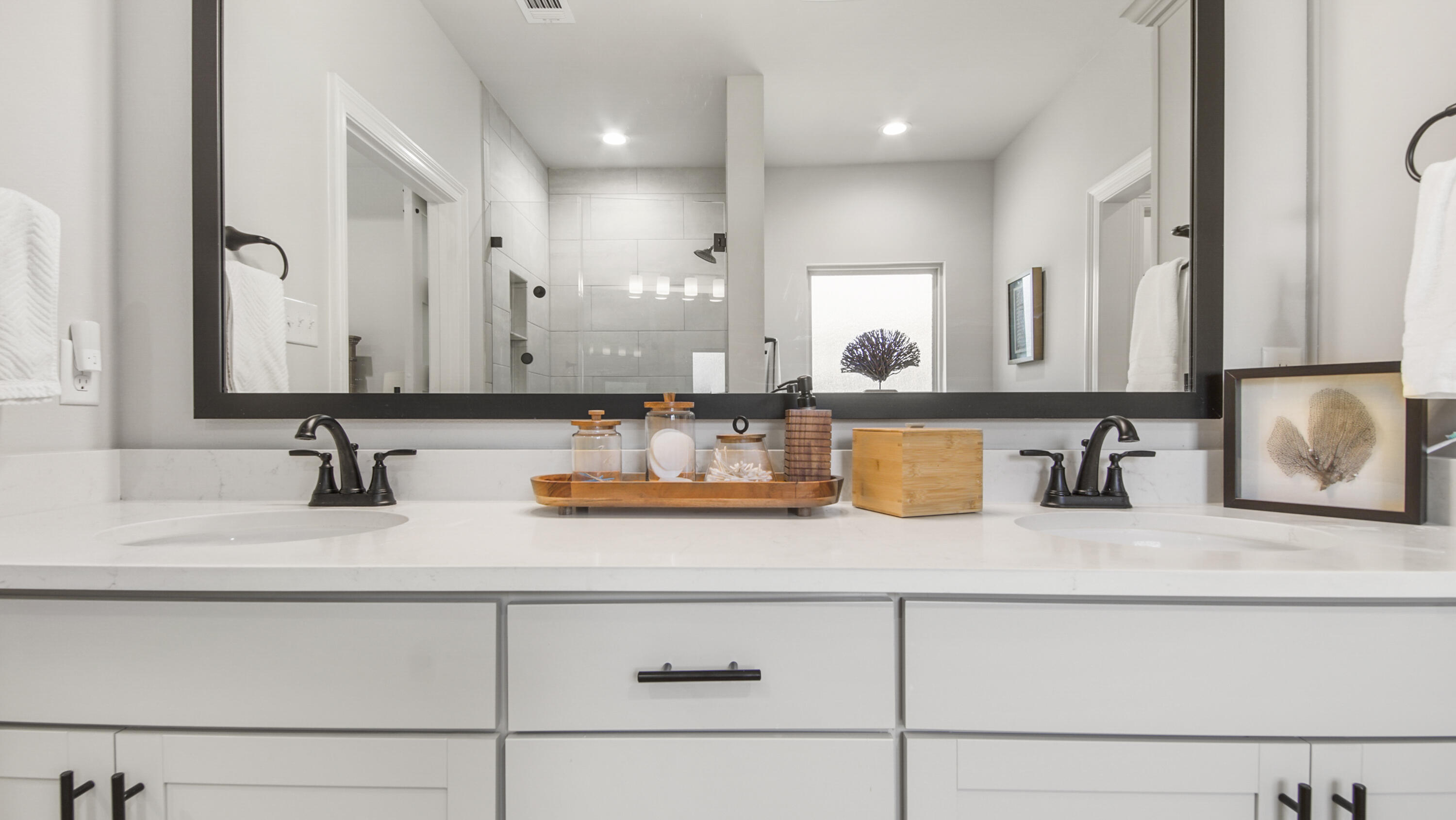 115 Flora Lane Freeport, FL 32439 - Photo 15 of 69 a bathroom with double vanity sinks and a mirror