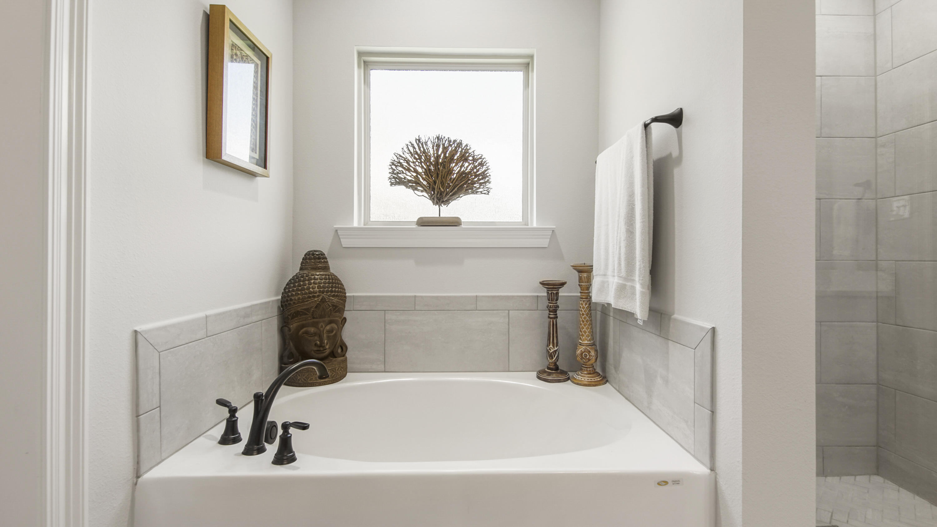 115 Flora Lane Freeport, FL 32439 - Photo 16 of 69 a bathroom with a bathtub and a window