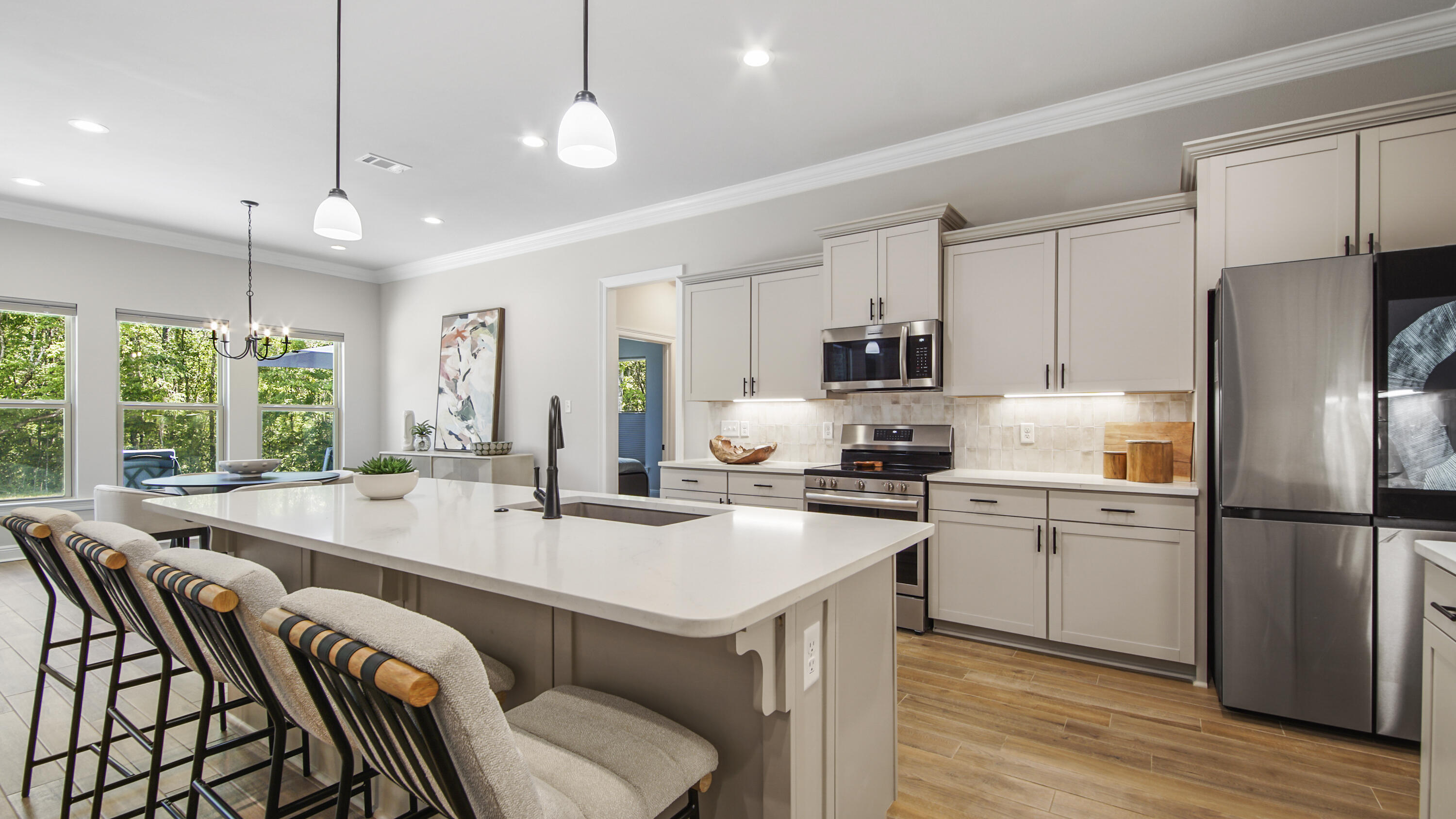 115 Flora Lane Freeport, FL 32439 - Photo 2 of 69 a kitchen with refrigerator cabinets dining table and chairs