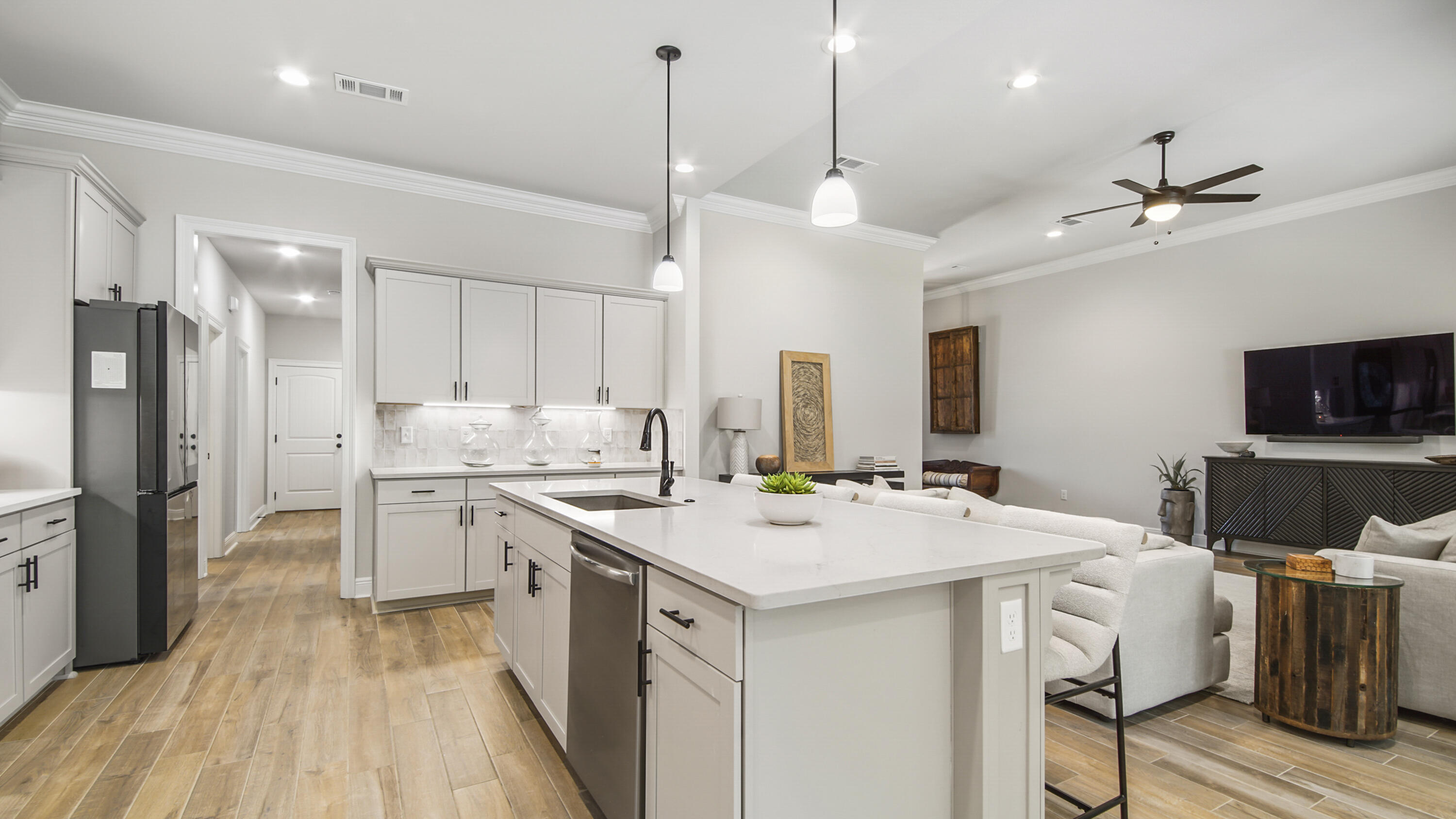 115 Flora Lane Freeport, FL 32439 - Photo 23 of 69 a kitchen with a stove a sink a refrigerator and a refrigerator