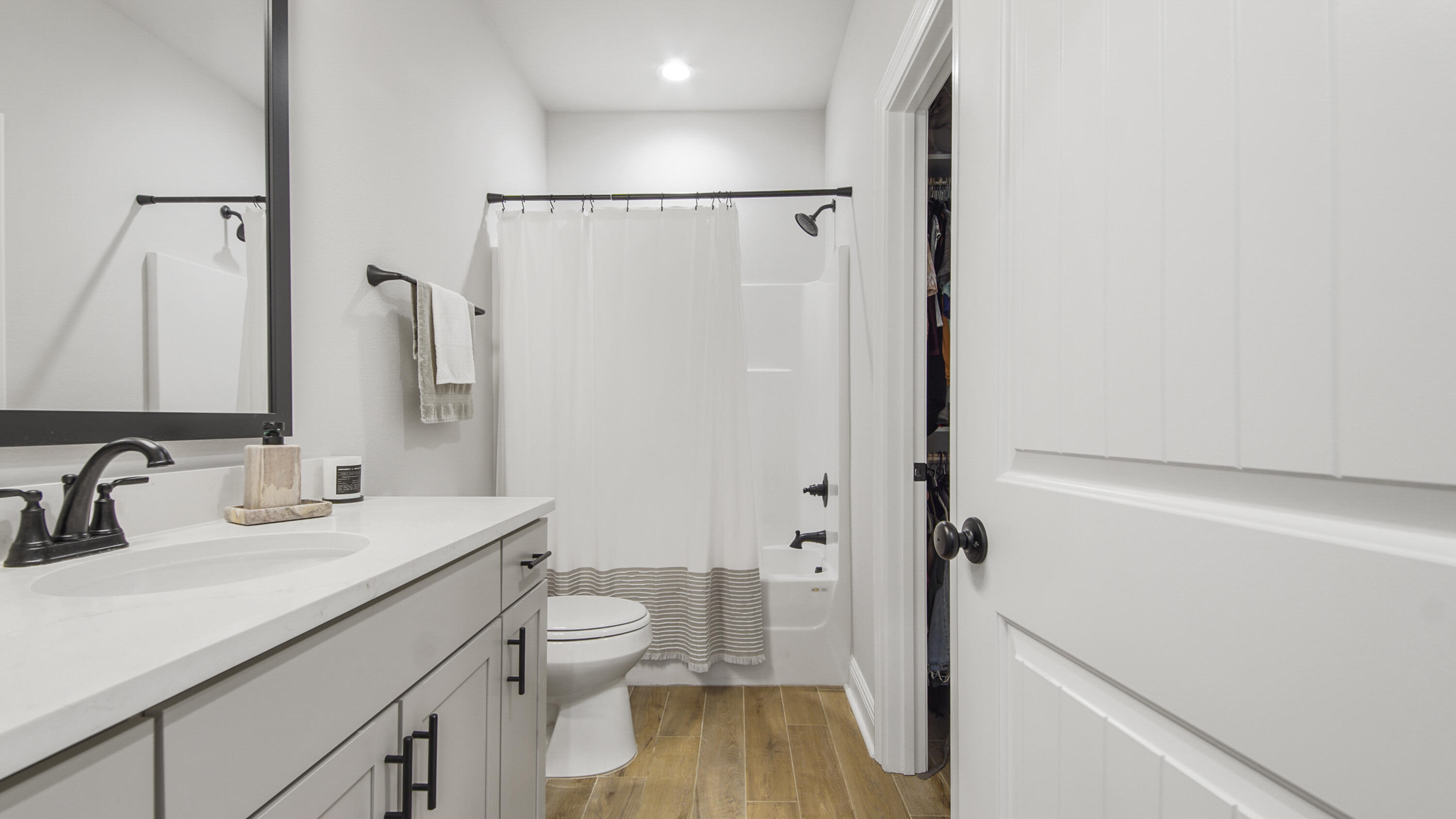 115 Flora Lane Freeport, FL 32439 - Photo 28 of 69 a bathroom with a granite countertop sink toilet and shower