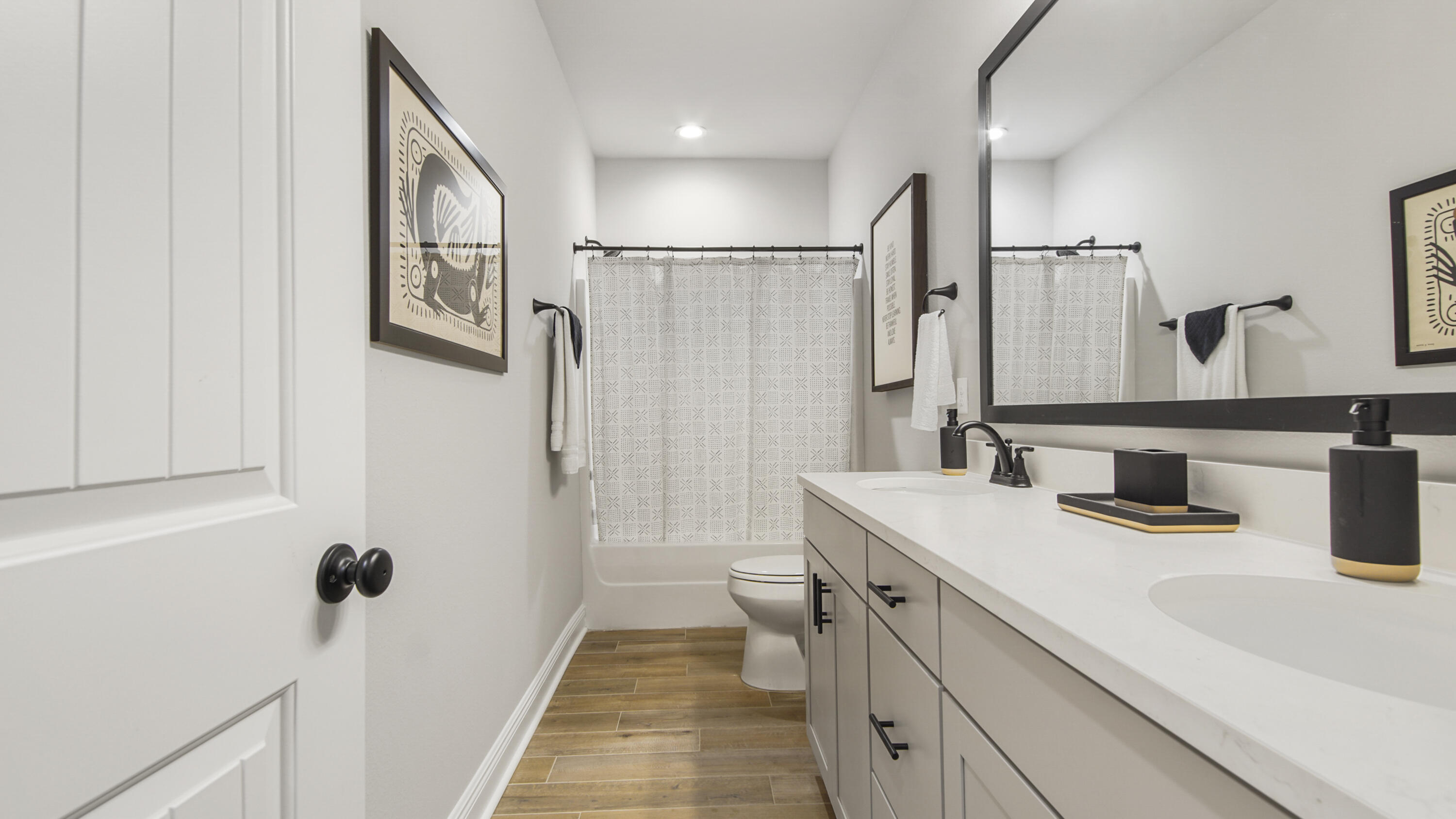 115 Flora Lane Freeport, FL 32439 - Photo 40 of 69 a bathroom with a sink a toilet a mirror and shower