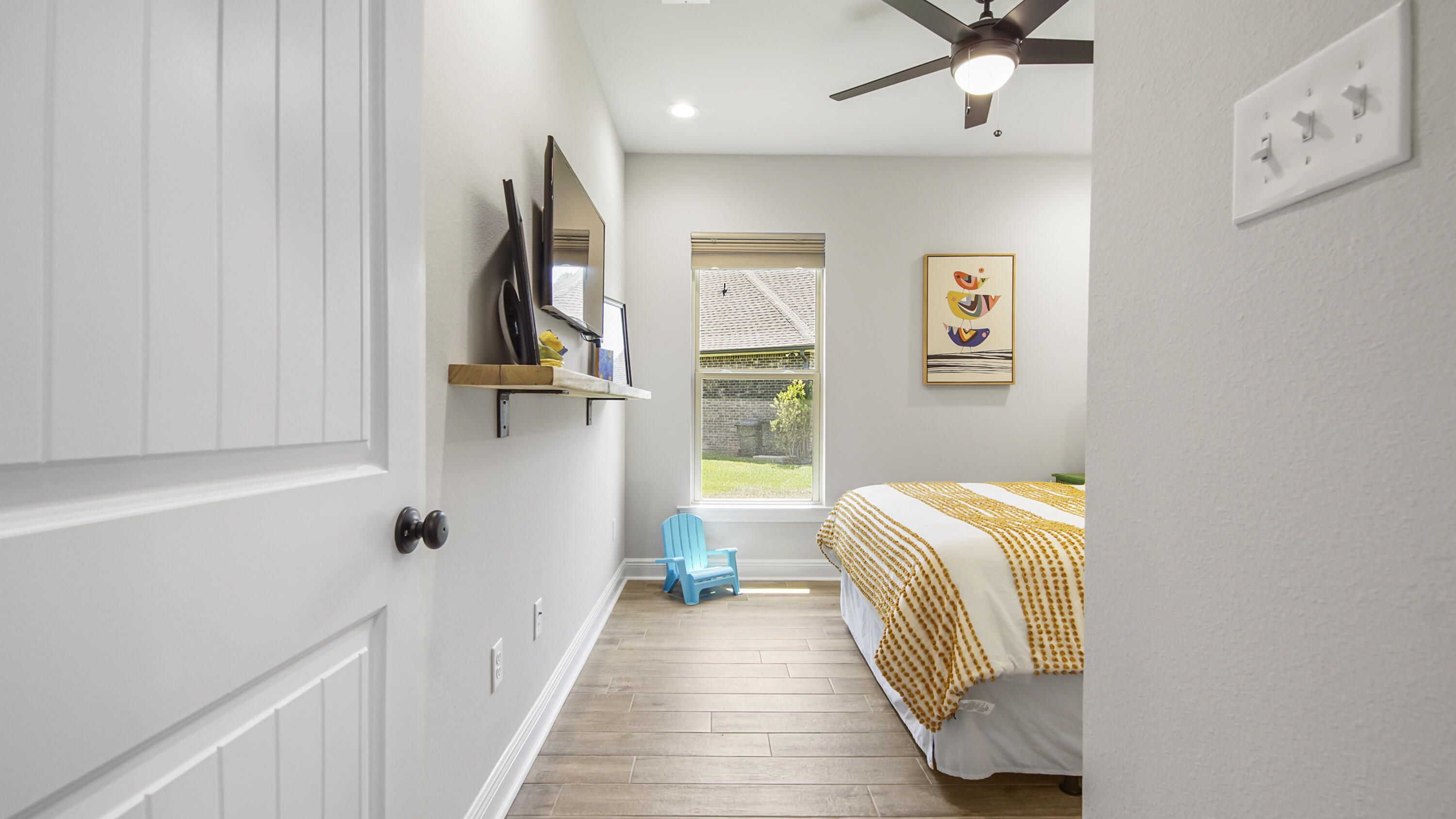 115 Flora Lane Freeport, FL 32439 - Photo 43 of 69 a view of hallway with wooden floor and chair