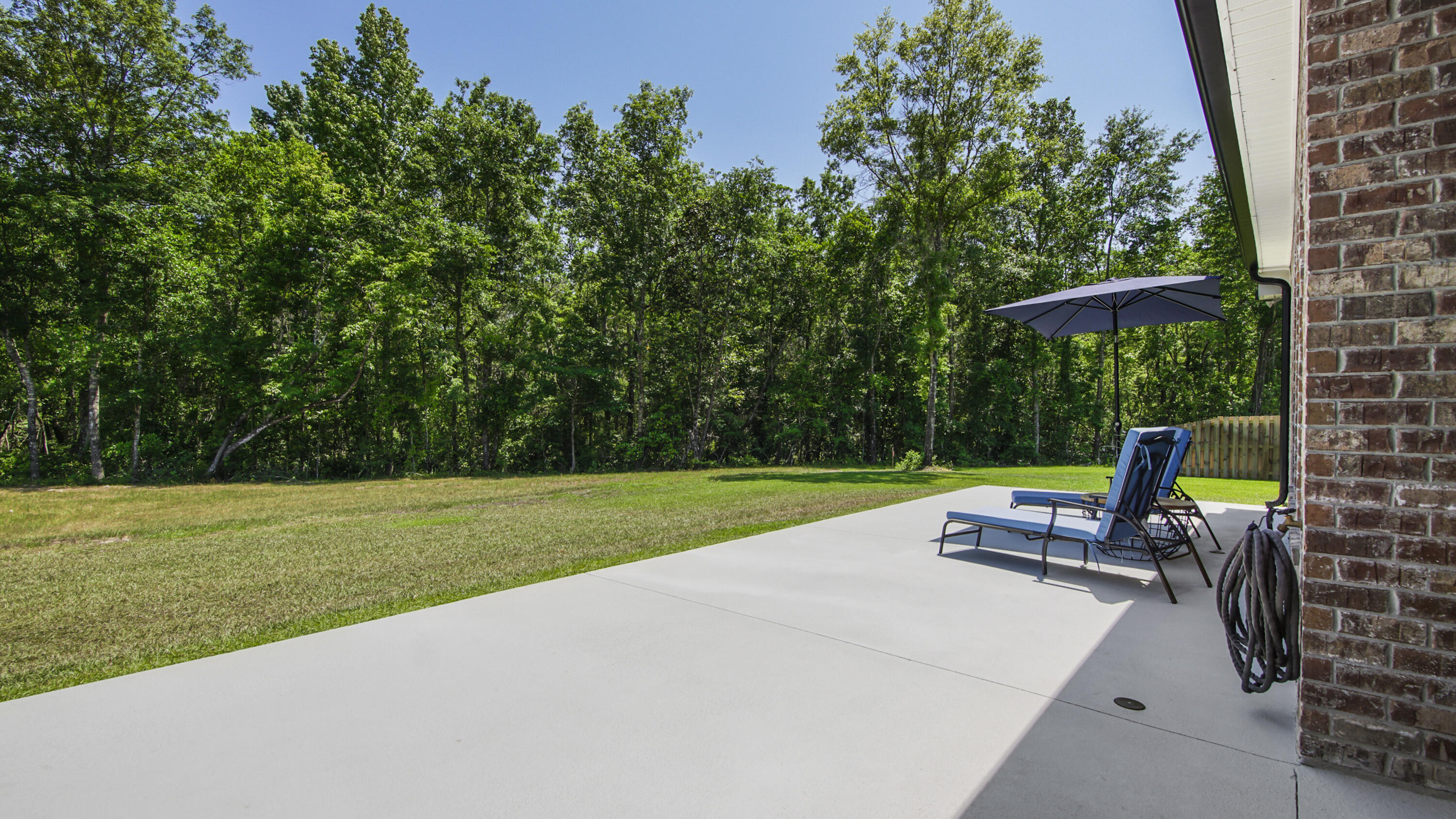 115 Flora Lane Freeport, FL 32439 - Photo 50 of 69 a view of outdoor space with garden and trees