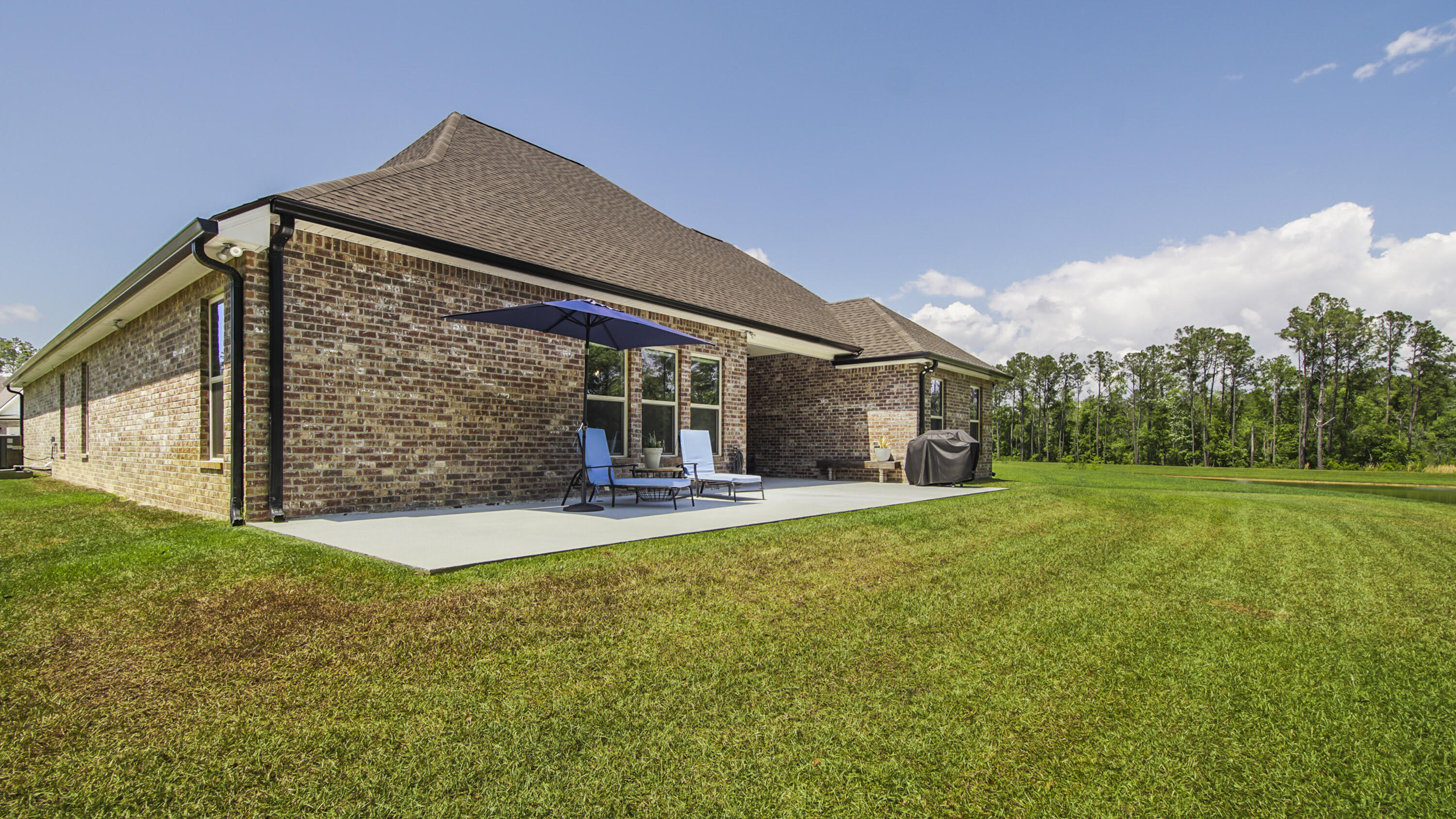 115 Flora Lane Freeport, FL 32439 - Photo 52 of 69 a front view of a house with yard and green space