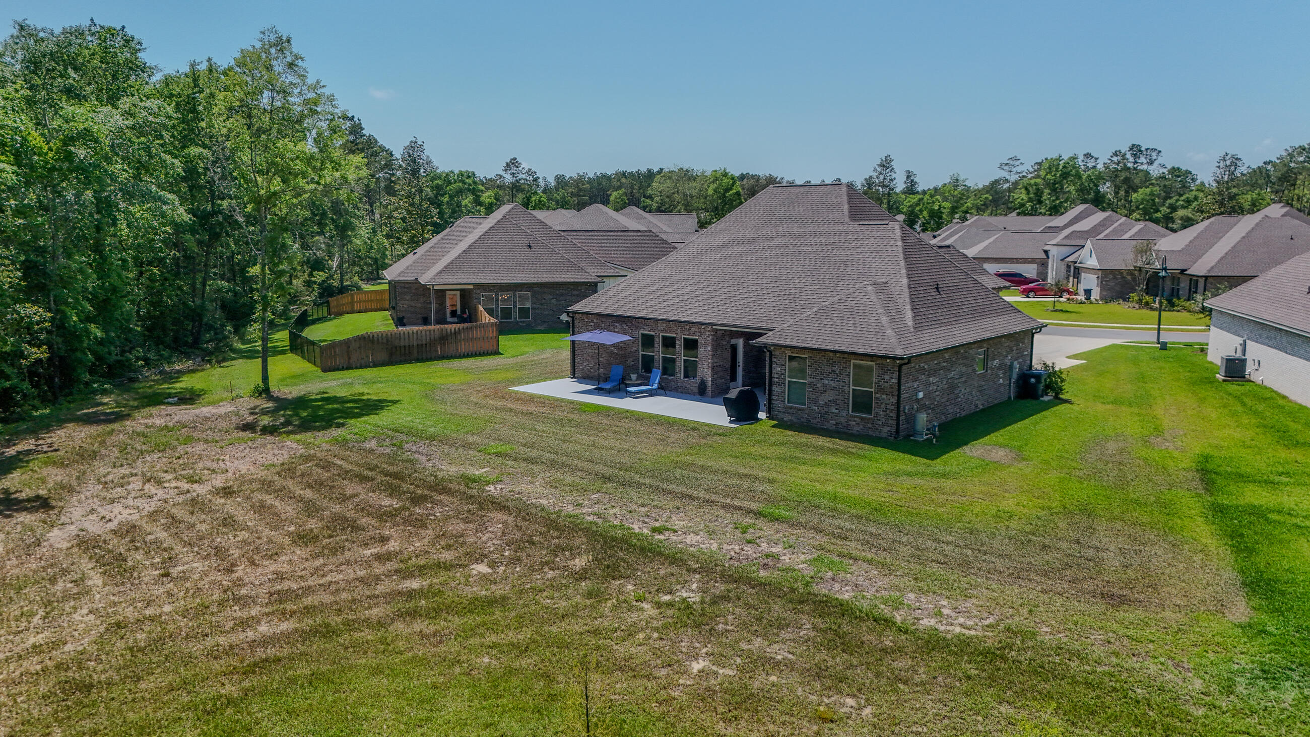 115 Flora Lane Freeport, FL 32439 - Photo 61 of 69 a aerial view of a house with a yard table and chairs