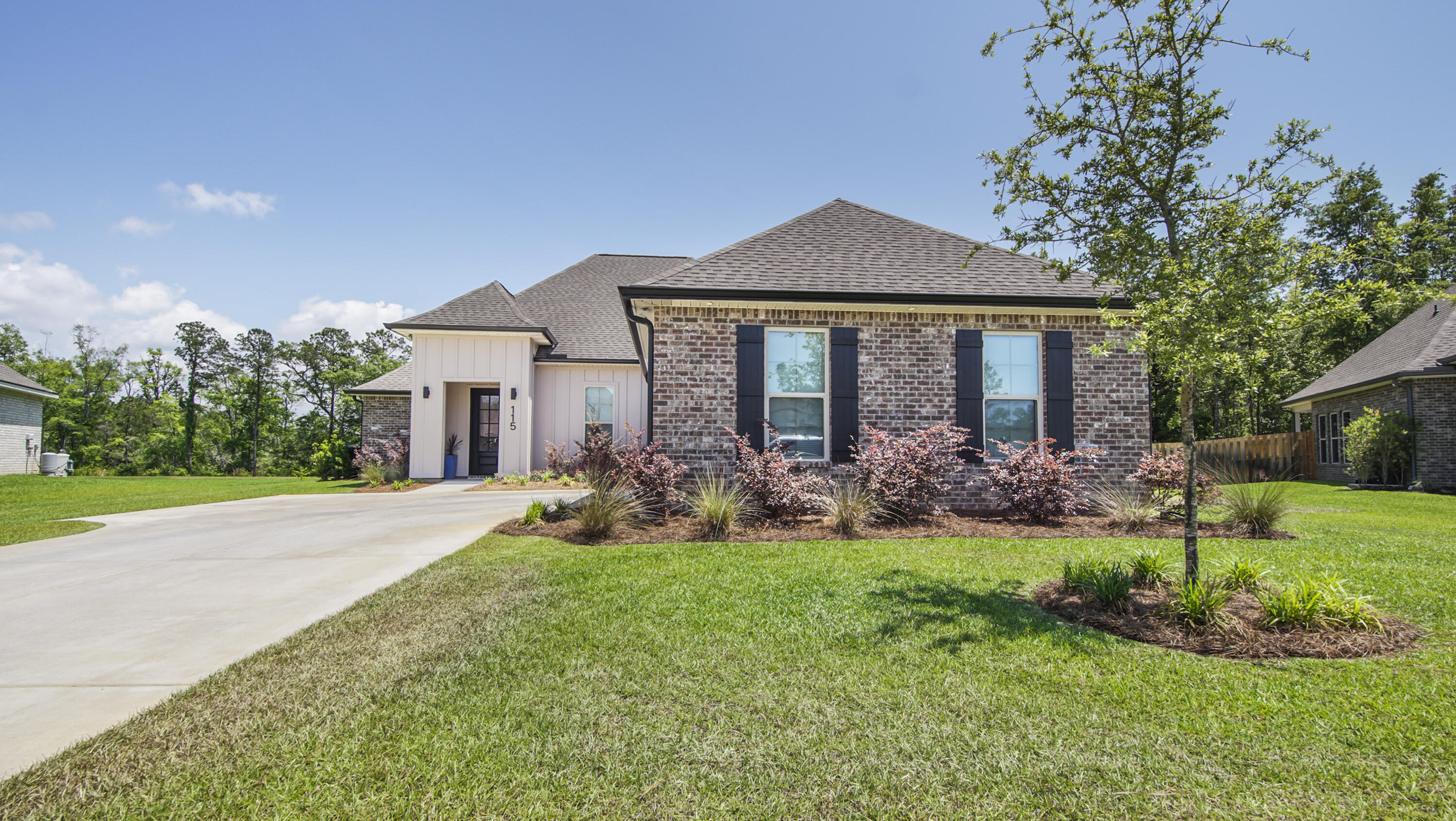 115 Flora Lane Freeport, FL 32439 - Photo 68 of 69 a front view of house with yard and green space