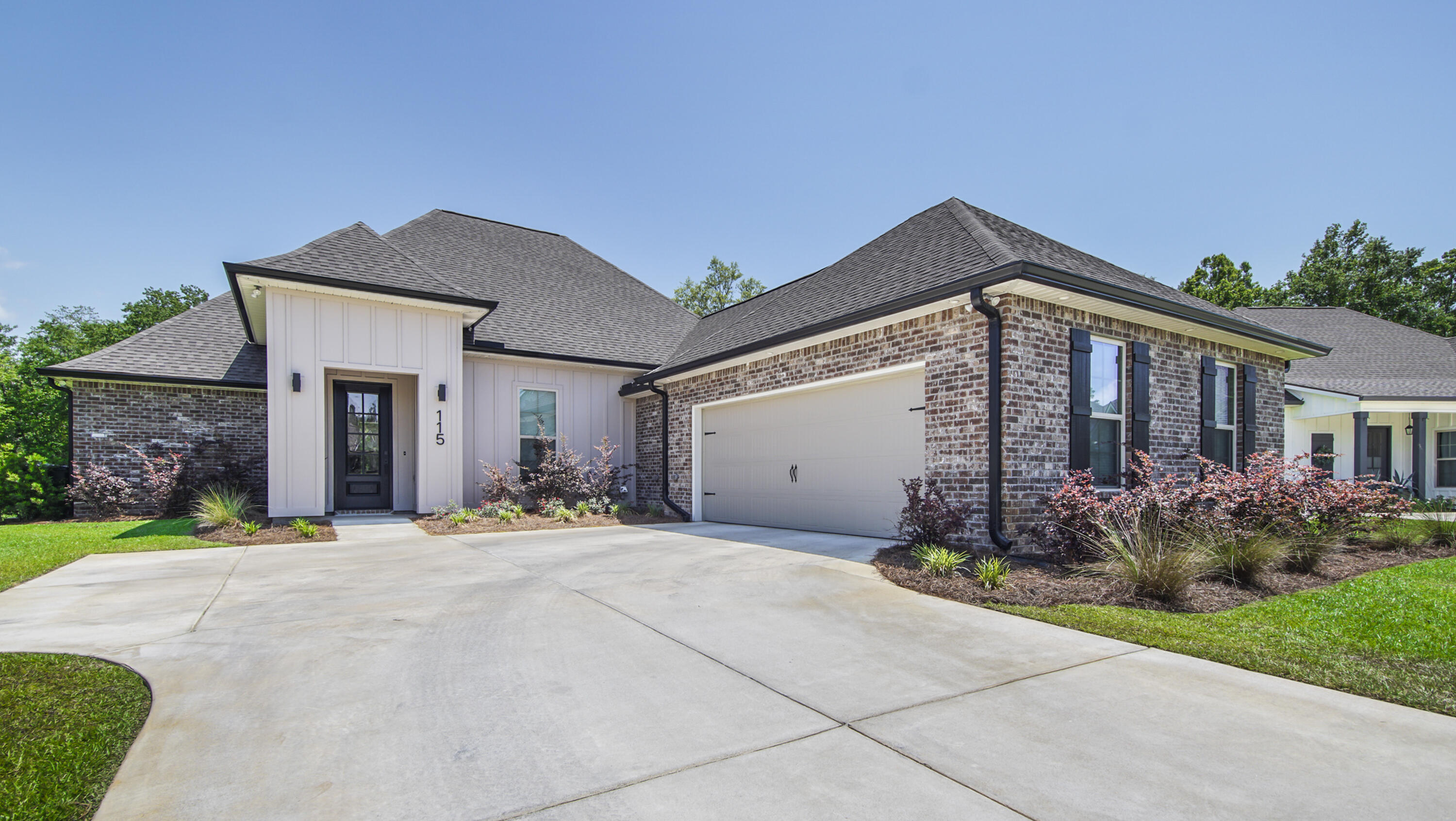 115 Flora Lane Freeport, FL 32439 - Photo 69 of 69 a front view of a house with a yard and outdoor seating
