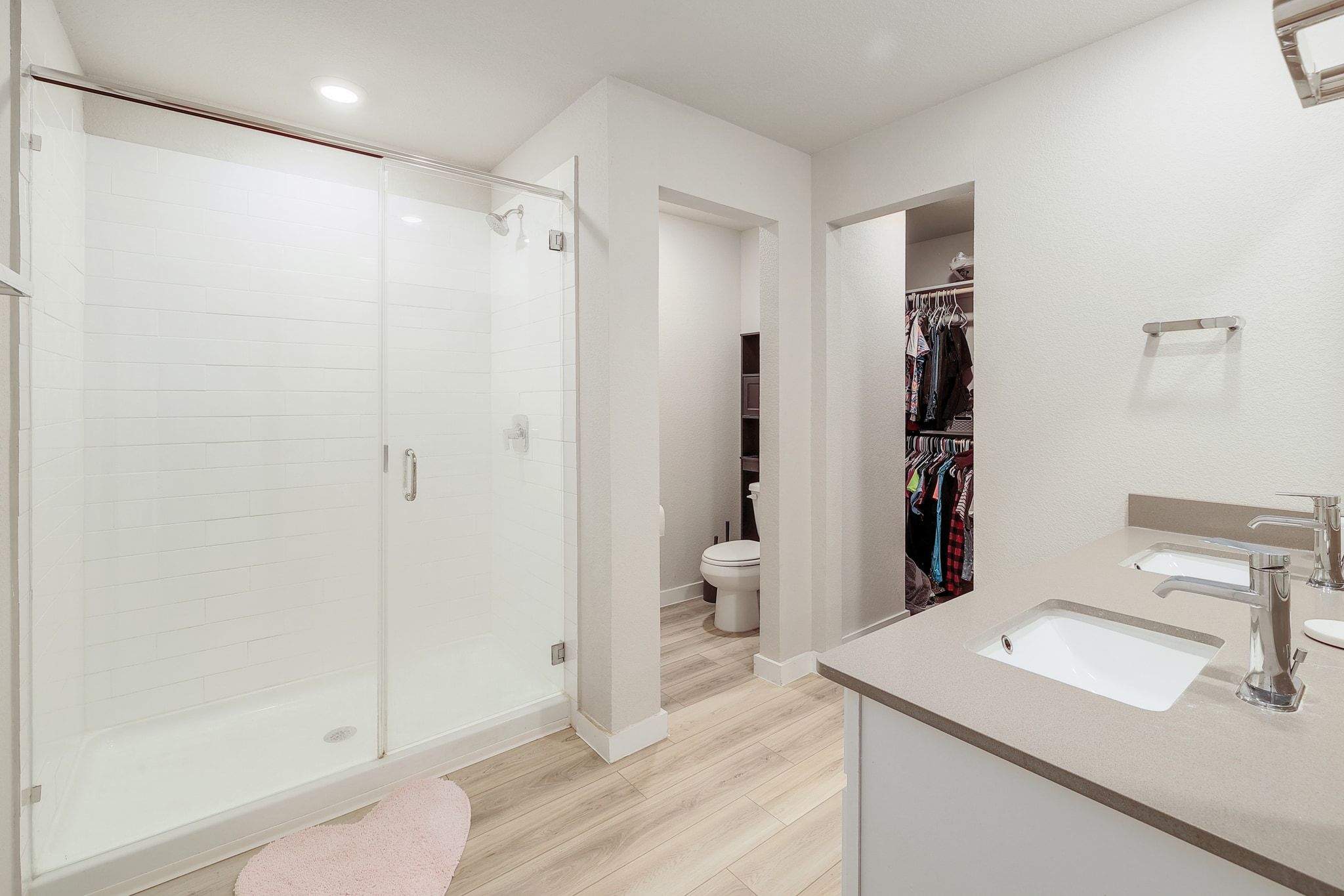 204 Halford Road Georgetown, TX 78633 - Photo 16 of 27 Full bathroom featuring double vanity, a shower stall, a spacious closet, light wood finished floors, and recessed lighting
