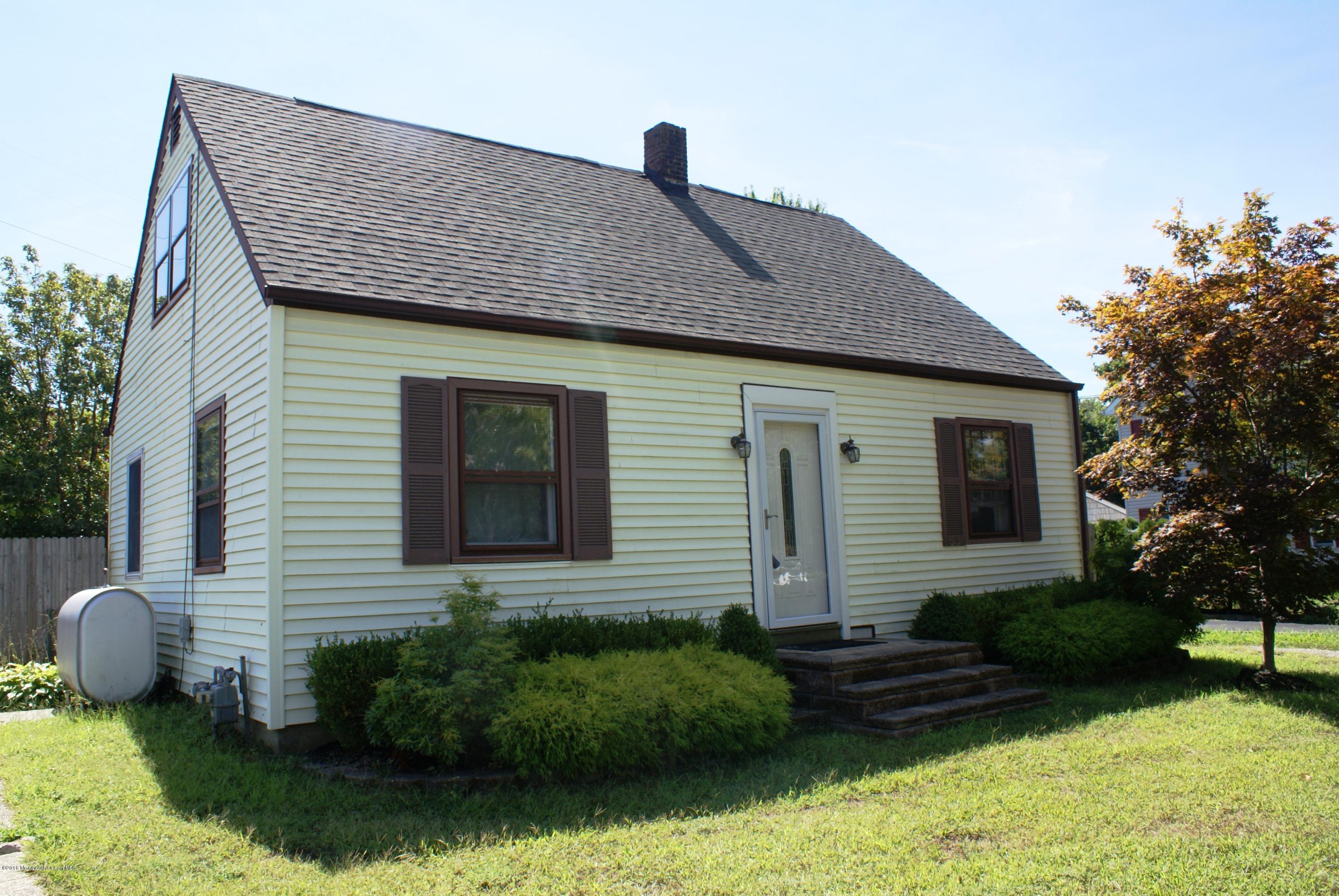 53 Tennent Road Morganville, NJ 07751 - Photo 1 of 11 a front view of a house with garden