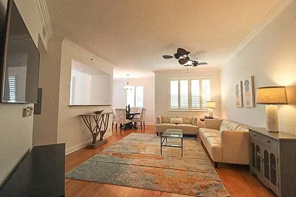 a living room with furniture rug and window