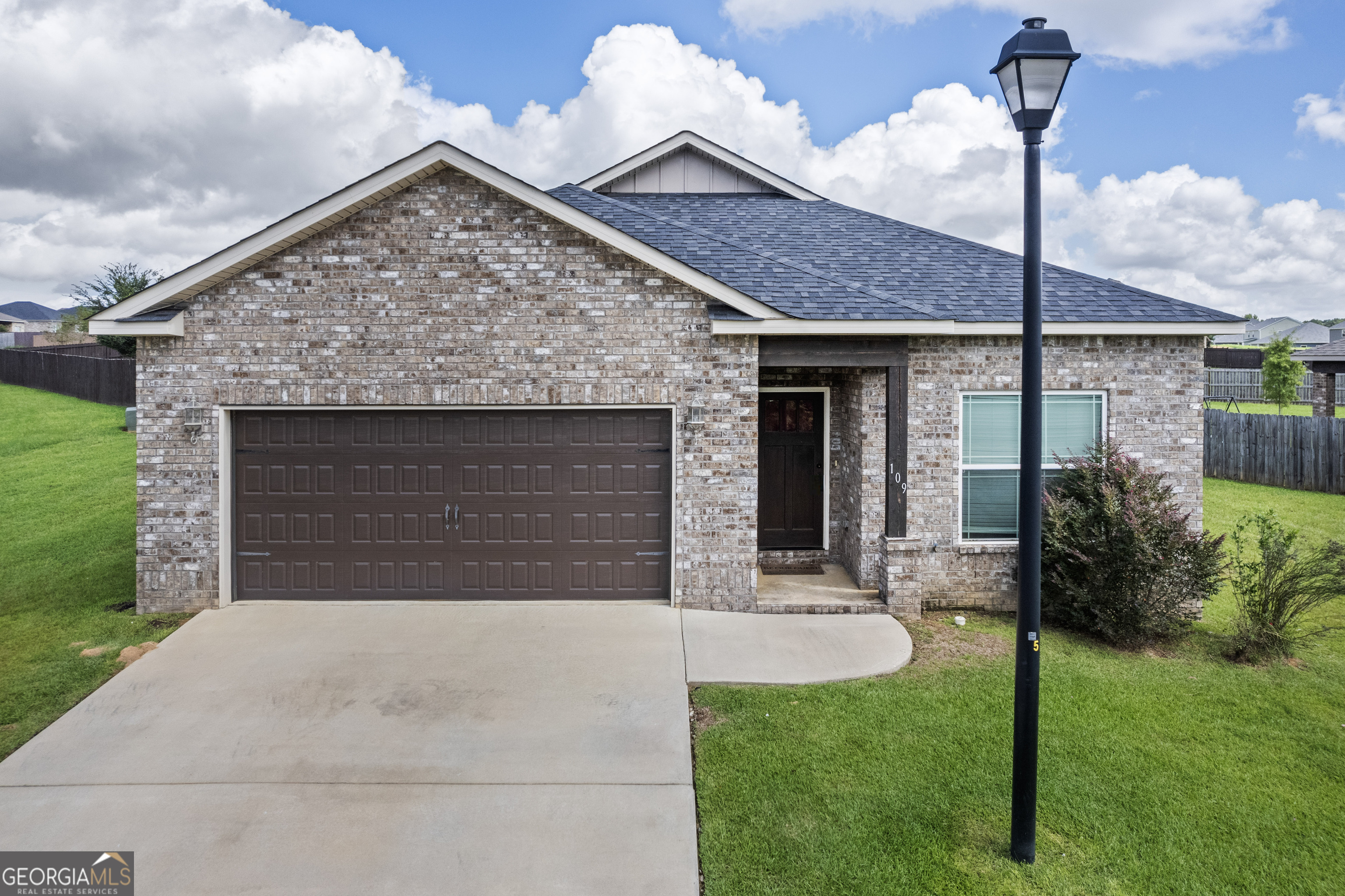 a front view of a house with a yard