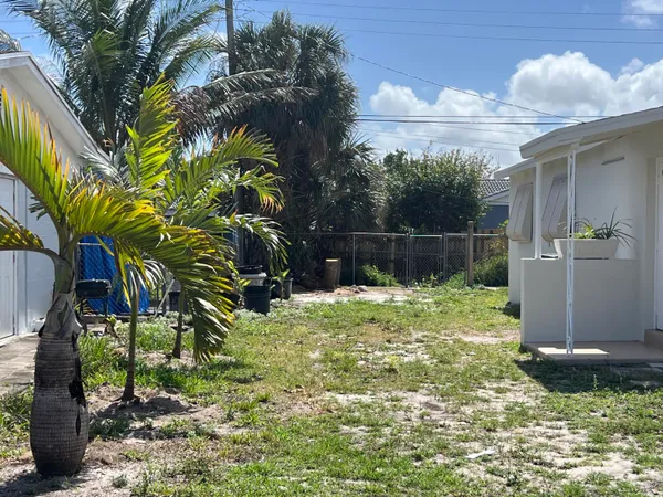 a backyard of a house with lots of green space