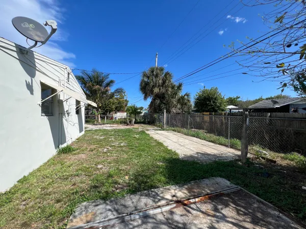 a view of backyard with green space