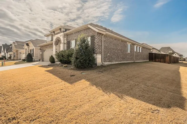 a view of a house with a snow in the yard