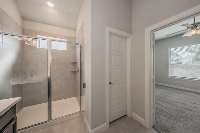 a bathroom with a double vanity sink and mirror