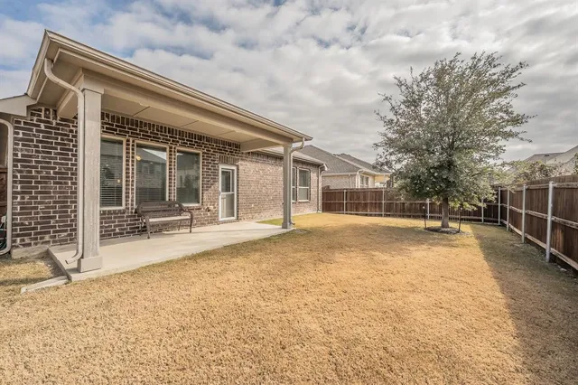 a view of a swimming pool with furniture