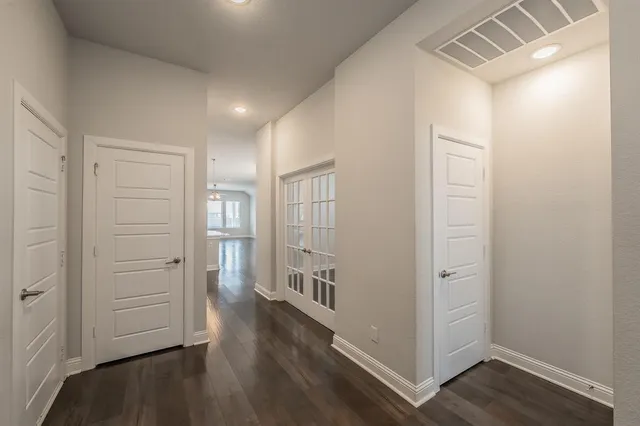 a view of an entryway with wooden floor