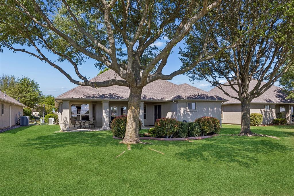 9221 Perimeter Street Denton, TX 76207 - Photo 29 of 36 a front view of a house with garden